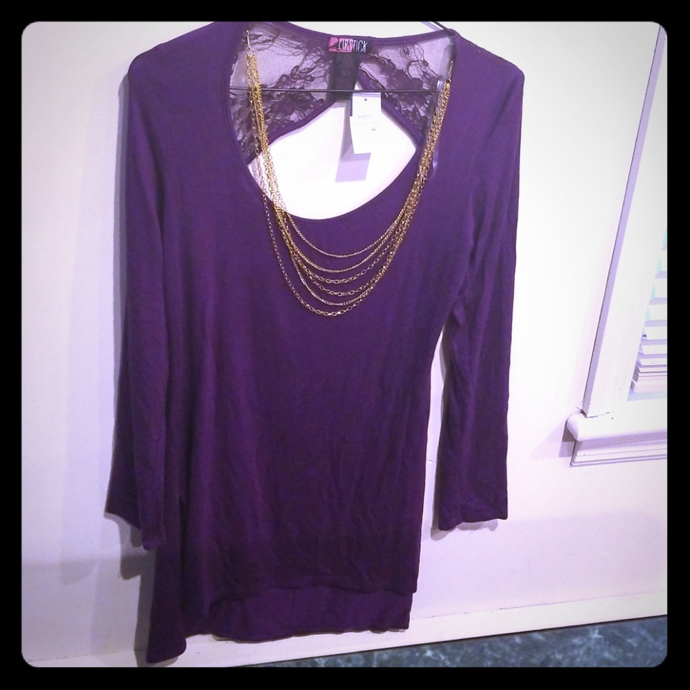 Large shirt. Necklaces attached